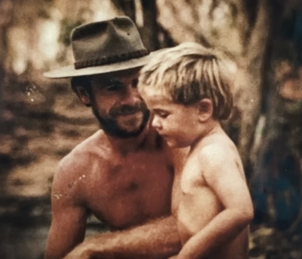 Craig Hemsworth looking adoringly at his young son Chris