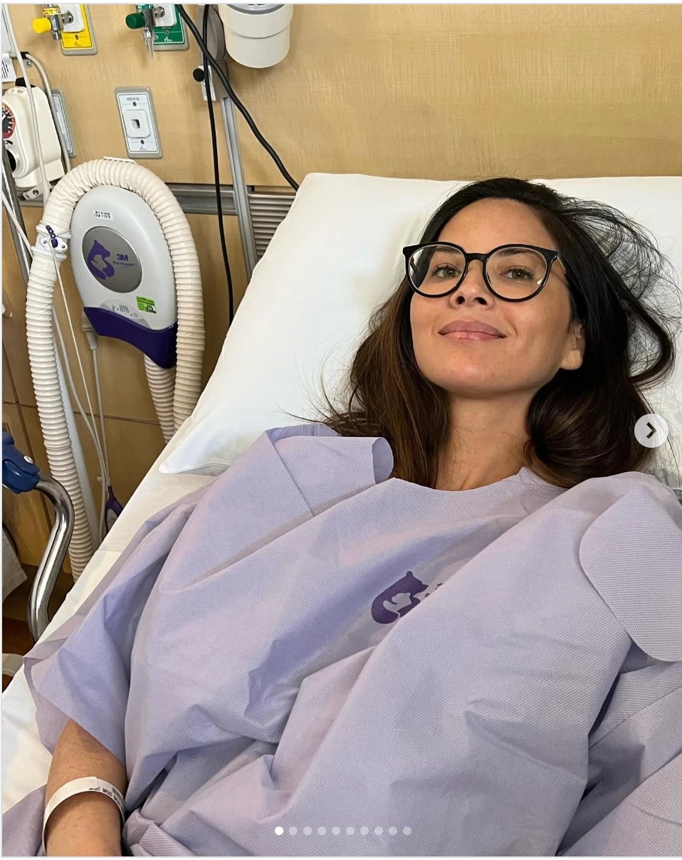 Olivia Munn in a hospital bed before surgery
