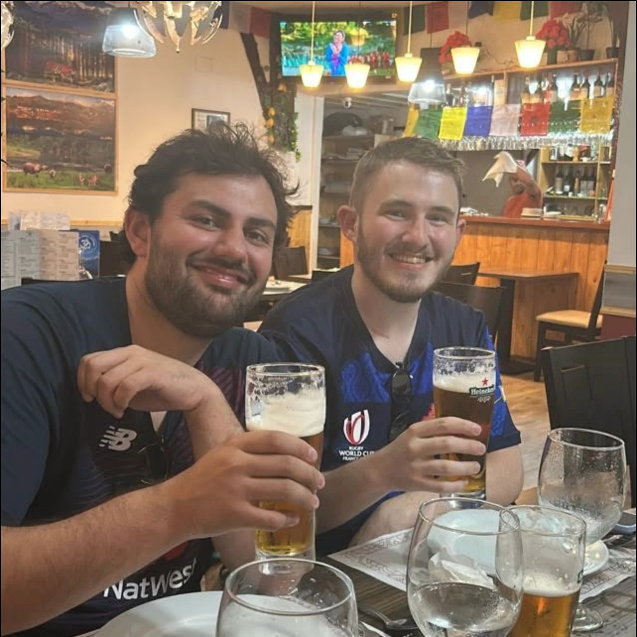 William Nijjer, left, enjoying a beer with a friend